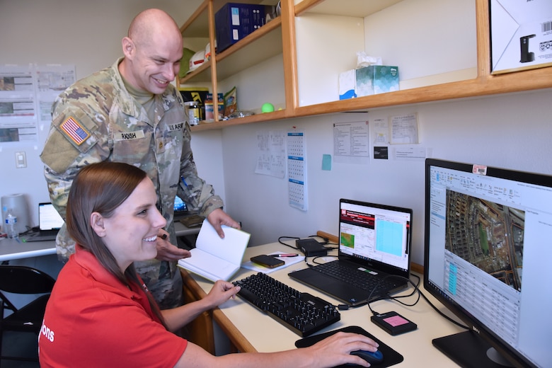 Kihei, Hawaiʻi, Recovery Field Office GIS analyst Lisa Hook discusses data collections with Operations Officer Maj. Vincent Radish.