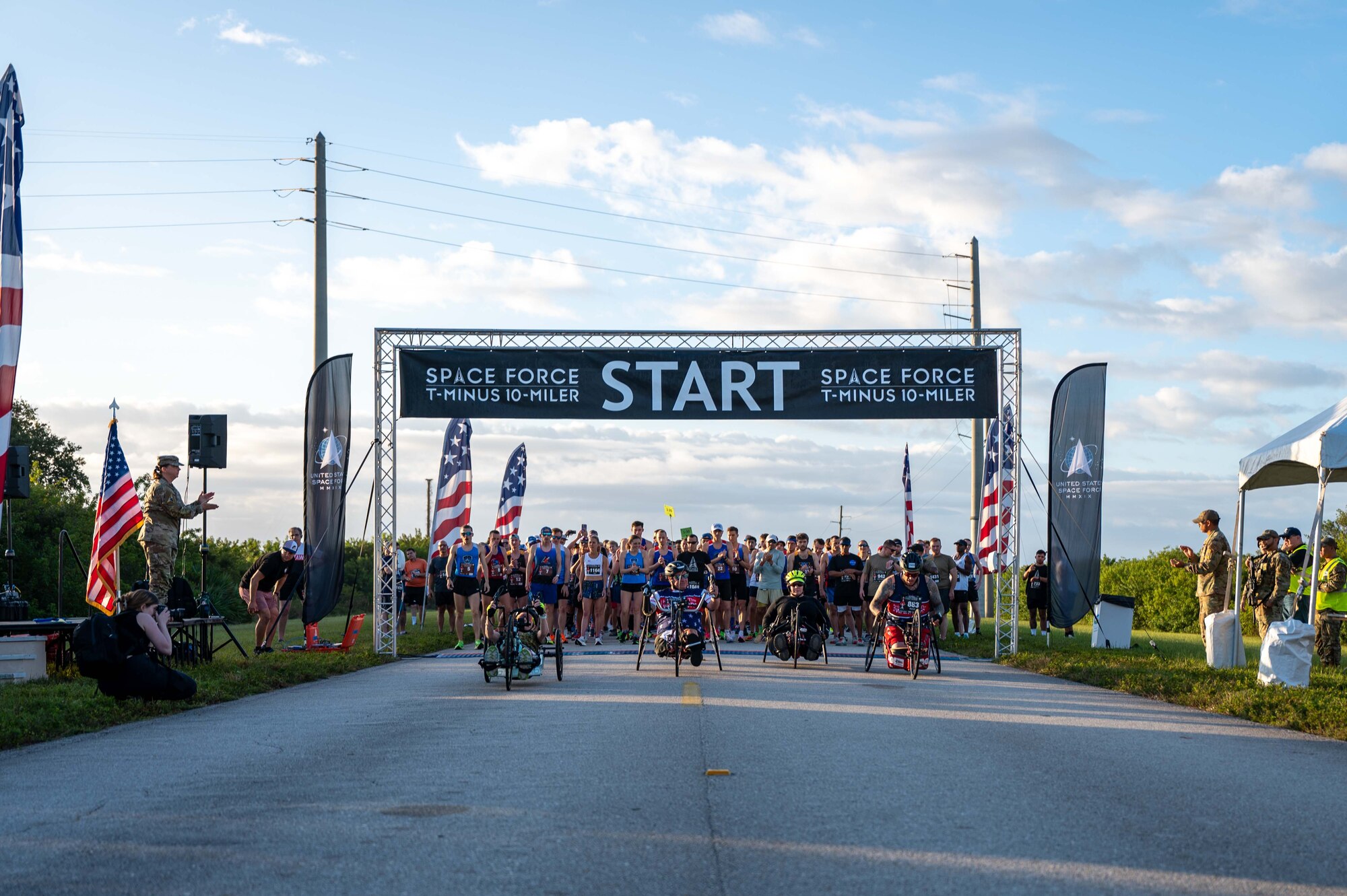 Participants cross the start line at the T-Minus 10-Miler at Cape Canaveral Space Force Station, Florida, Dec. 9, 2023. The T-Minus 10-Miler celebrates the Space Forces birthday. (U.S. Space Force photo by Senior Airman Samuel Becker)