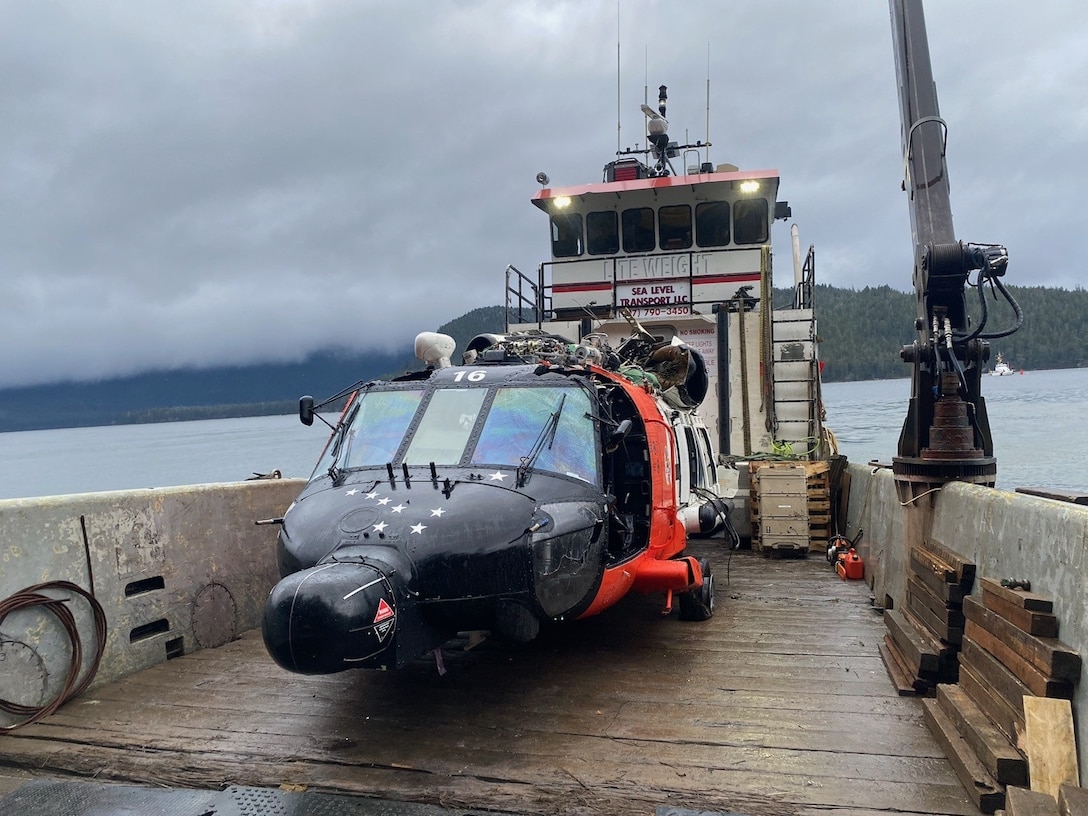 A U.S. Coast Guard MH-60 Jayhawk helicopter from Air Station Sitka sits on a boat after being recovered from the site of a crash near Read Island, Alaska, December 8, 2023. The four crew members involved in the crash on Nov. 13, 2023 all survived. (U.S. Coast Guard photo courtesy of Air Station Sitka.)