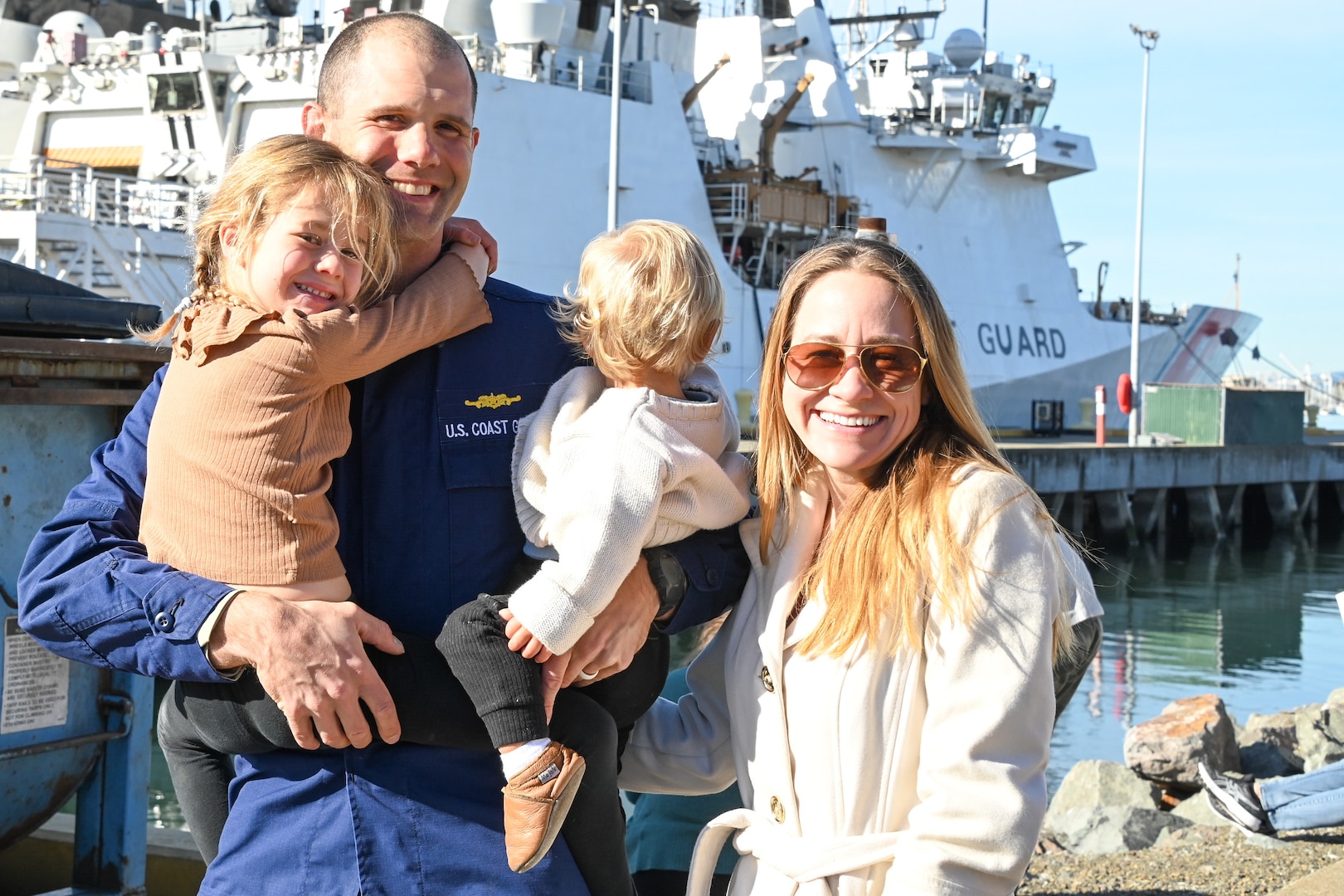 Family and friends celebrate as the U.S. Coast Guard Cutter Waesche (WMSL 751) crew returns to homeport in Alameda, Calif., Dec. 9, 2023. The Waesche and crew spent 89-days patrolling more than 19,740 miles in the Eastern Pacific Ocean conducting law enforcement and search and rescue operations in international waters off Central and South America. (U.S. Coast Guard photo by Senior Chief Petty Officer Charly Tautfest)