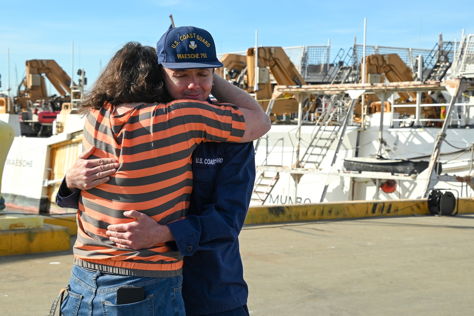 Family and friends celebrate as the U.S. Coast Guard Cutter Waesche (WMSL 751) crew returns to homeport in Alameda, Calif., Dec. 9, 2023. The Waesche and crew spent 89-days patrolling more than 19,740 miles in the Eastern Pacific Ocean conducting law enforcement and search and rescue operations in international waters off Central and South America. (U.S. Coast Guard photo by Senior Chief Petty Officer Charly Tautfest)