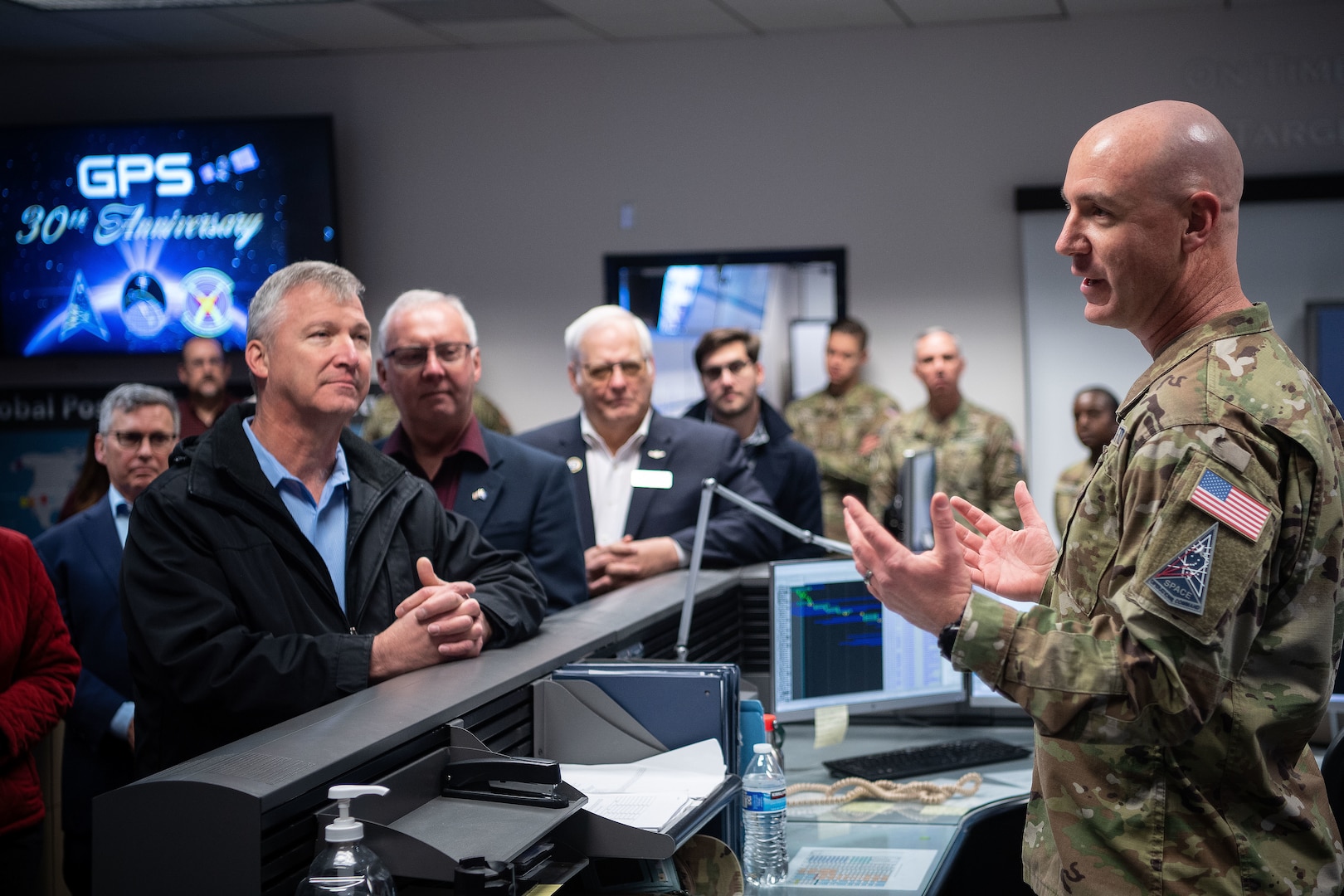 Col. Andrew Menschner, briefs civic leaders.