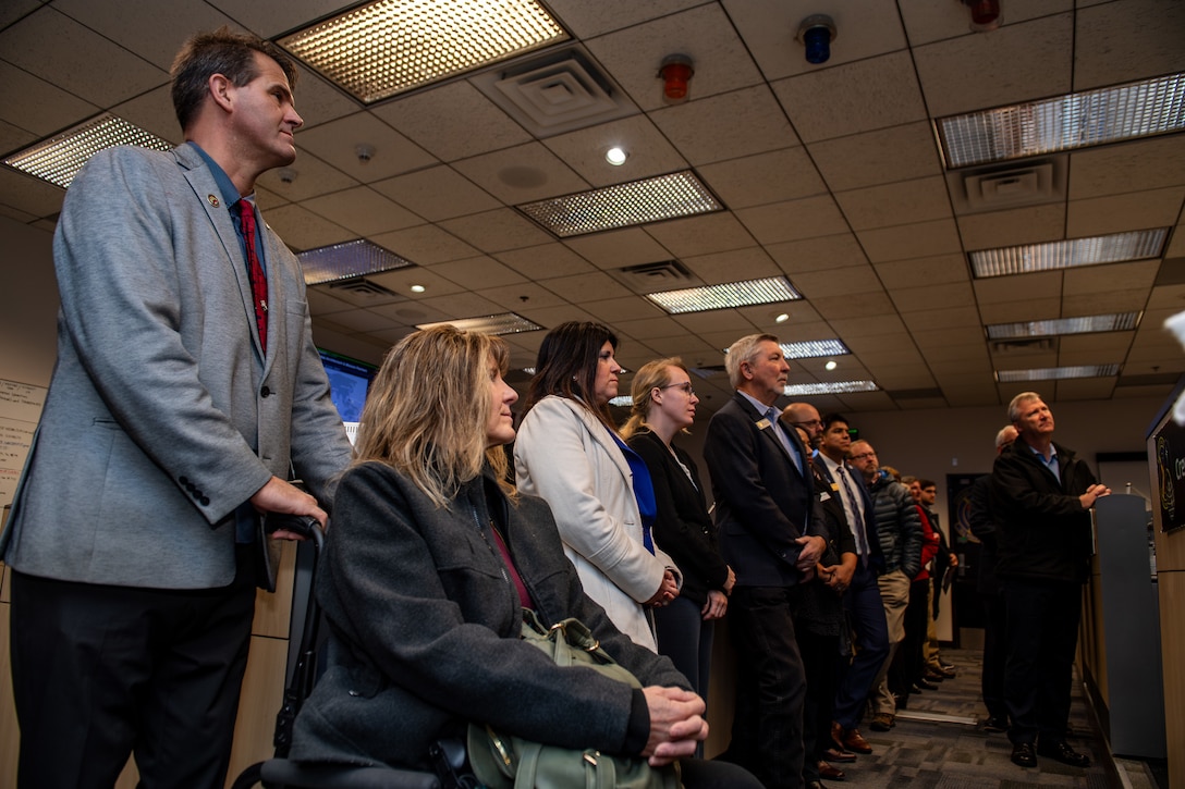 Civic leaders listen to briefing.