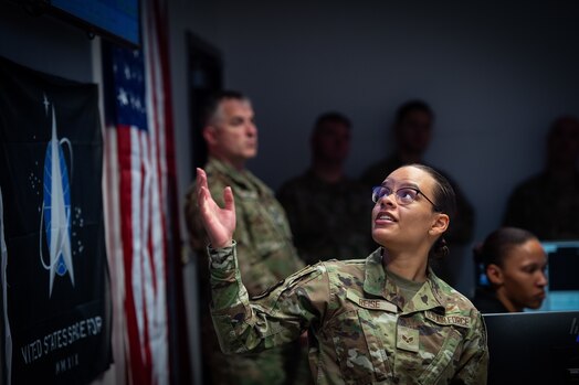  U.S. Air Force Reservist, SrA Atheena Reise, 19th Space Operations Squadron Space Systems Operator, briefs civic leaders.