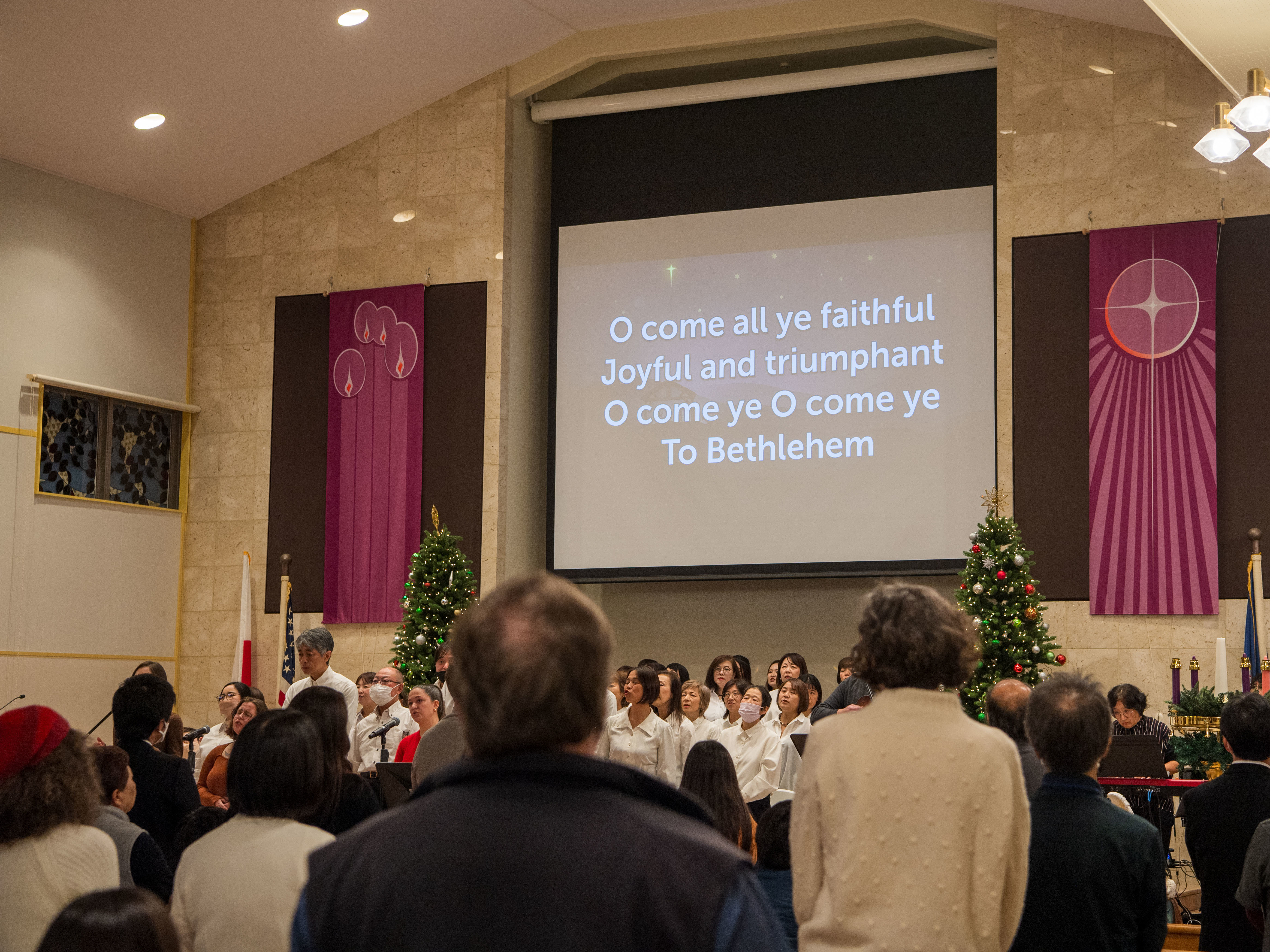 CFAY Chapel of Hope guests sing Christmas carols at the International Christmas Celebration in Yokosuka, Japan