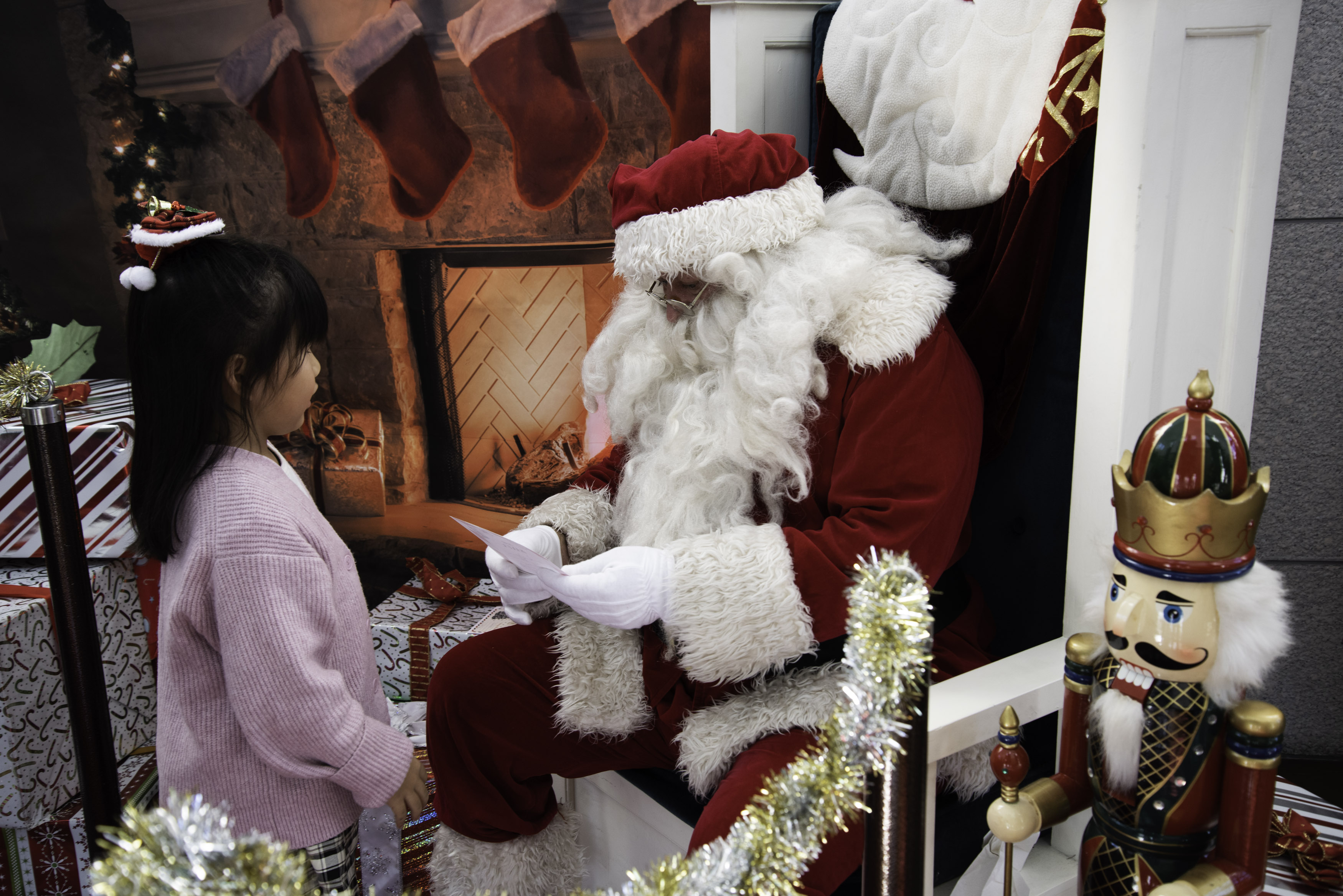 Santa Claus reads a child's list at CFAY Festival of Trees December 9, 2023.