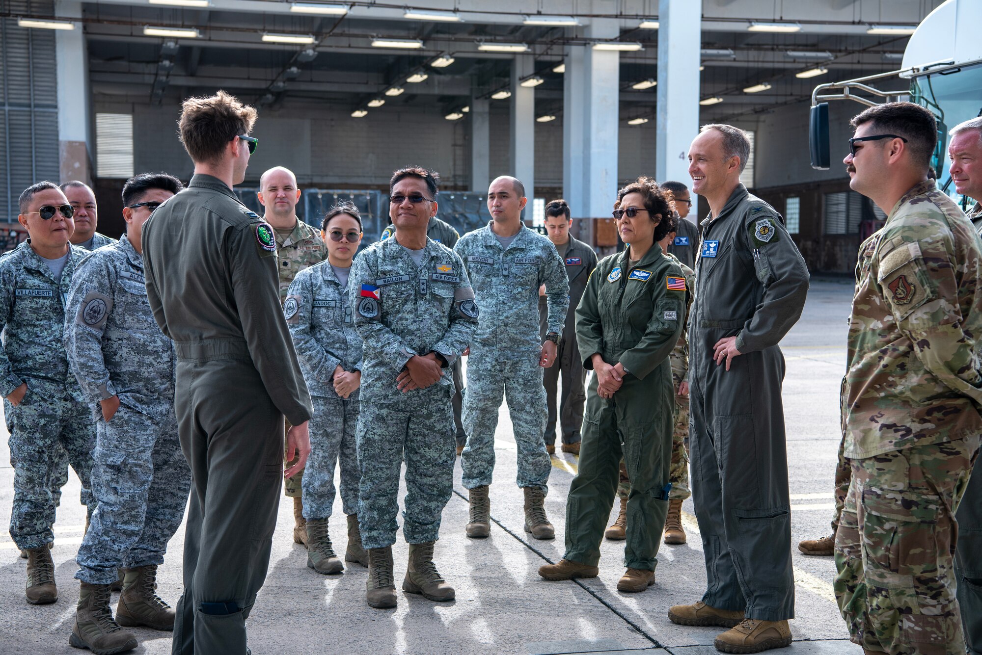 military members gathered together to hear a brief
