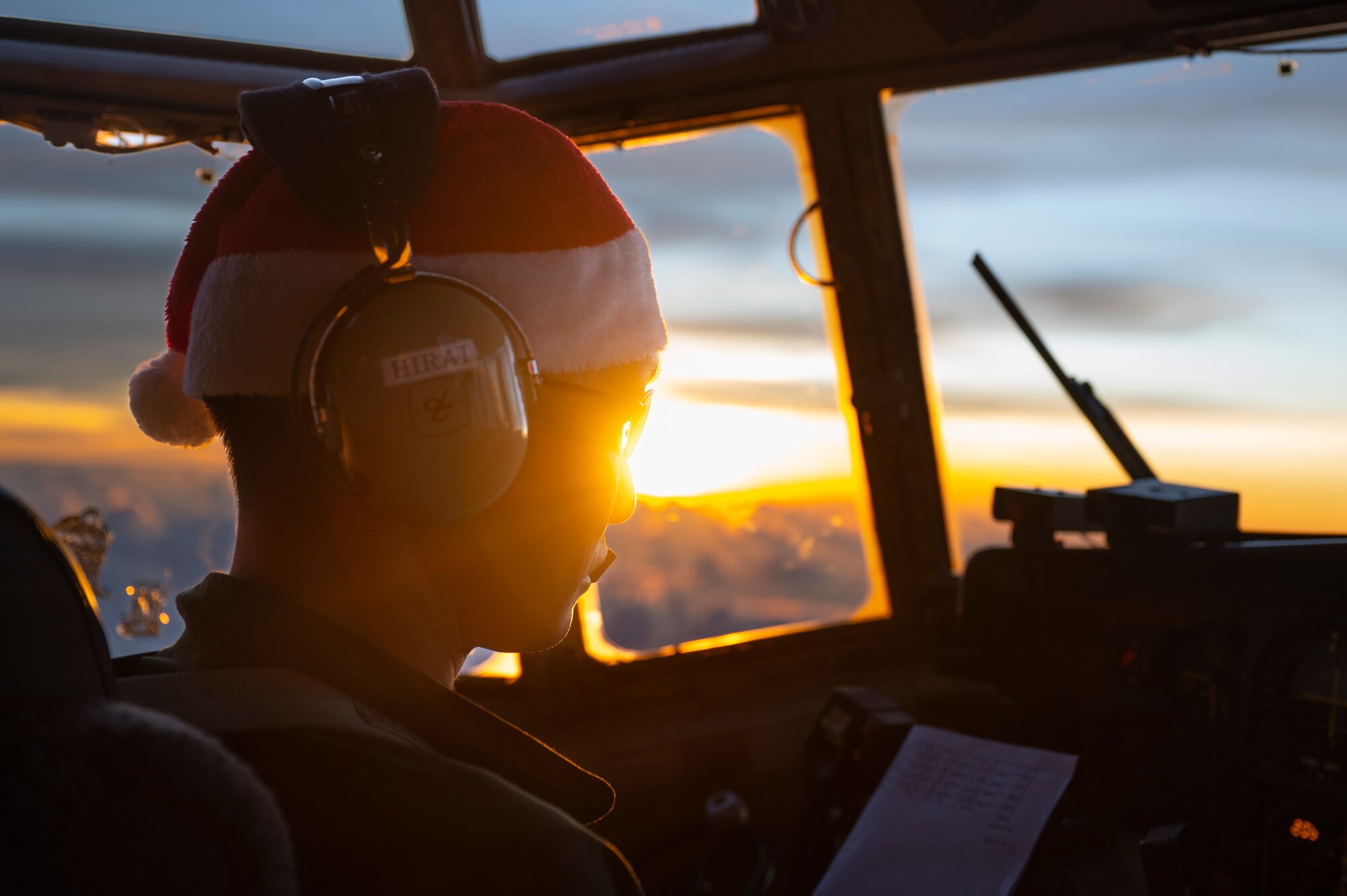 Japan Air Self-Defense Force (JASDF) Maj. Kentaro Hirai, 401st Tactical Airlift Squadron pilot, flies a JASDF C-130H Hercules during Operation Christmas Drop 2023 (OCD 23) above the Federated States of Micronesia, Dec. 6, 2023. OCD is the Department of Defense’s longest-running humanitarian airlift operation which consists of packaging and delivering donated supplies such as food, fishing equipment, school books and clothing to more than 20,000 islanders across 58 remote islands throughout the Pacific. (U.S. Air Force photo by Airman 1st Class Spencer Perkins)