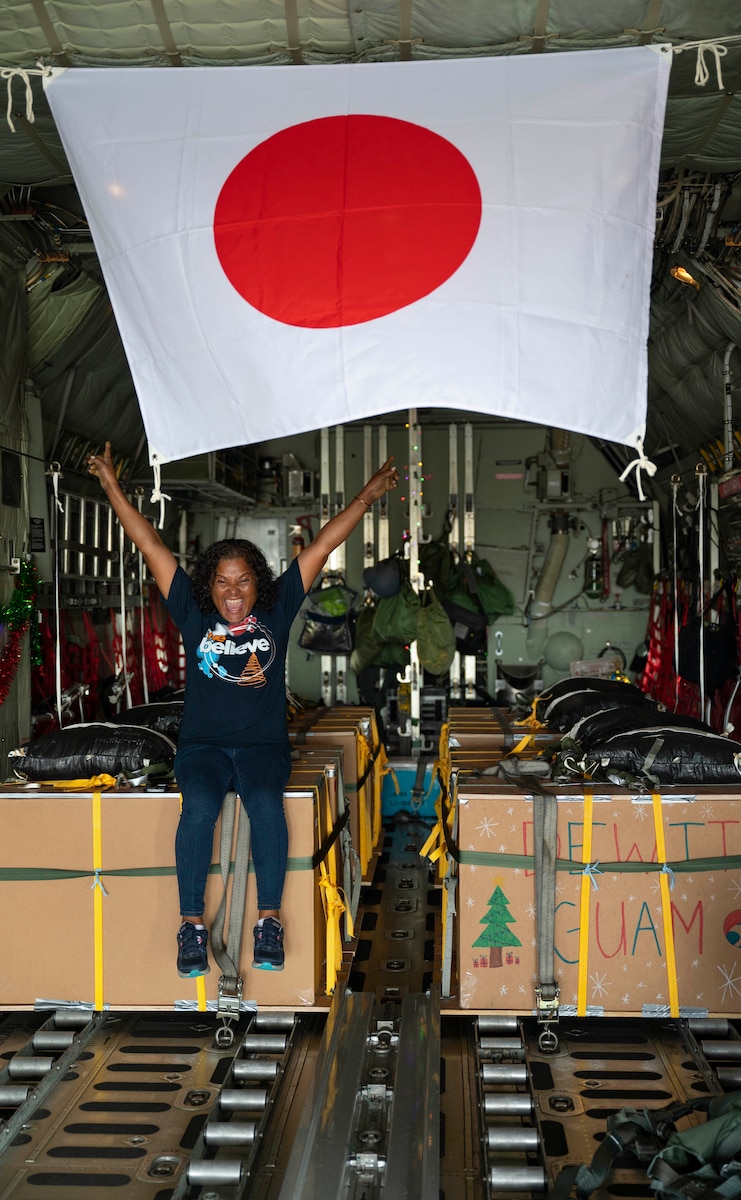 Nanako Lipai, a Mokil Atoll native, poses for a photo aboard a Japan Air Self-Defense Force C-130H Hercules for Operation Christmas Drop 2023 (OCD 23), at Andersen Air Force Base, Guam, Dec. 6, 2023. Established in 1952, OCD has evolved into the longest-running Department of Defense humanitarian aid and disaster relief mission, benefiting over 20 thousand islanders on 58 islands throughout the Federated States of Micronesia and the Republic of Palau. This was Lipai’s third time flying during OCD but it was the first time she got to fly to her home island to drop supply bundles. (U.S. Air Force photo–by Airman 1st Class Spencer Perkins)