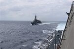 SOUTH CHINA SEA (December 7, 2023) - The Independence-variant littoral combat ship USS Gabrielle Giffords (LCS 10) steams with the Murasame-class general-purpose destroyer JS Ikazuchi (DD 107) in the South China Sea, Dec 7. The bilateral maritime exercise between U.S. and Japan Maritime Self-Defense Forces demonstrated combined capabilities to counter regional threats and maintain peace and stability in the Indo-Pacific region. Gabrielle Giffords, part of Commander, Destroyer Squadron 7, is a rotational deployment operating in the U.S. 7th Fleet area of operations to enhance interoperability with Allies and partners and serve as a ready-response force in support of a free and open Indo-Pacific region.