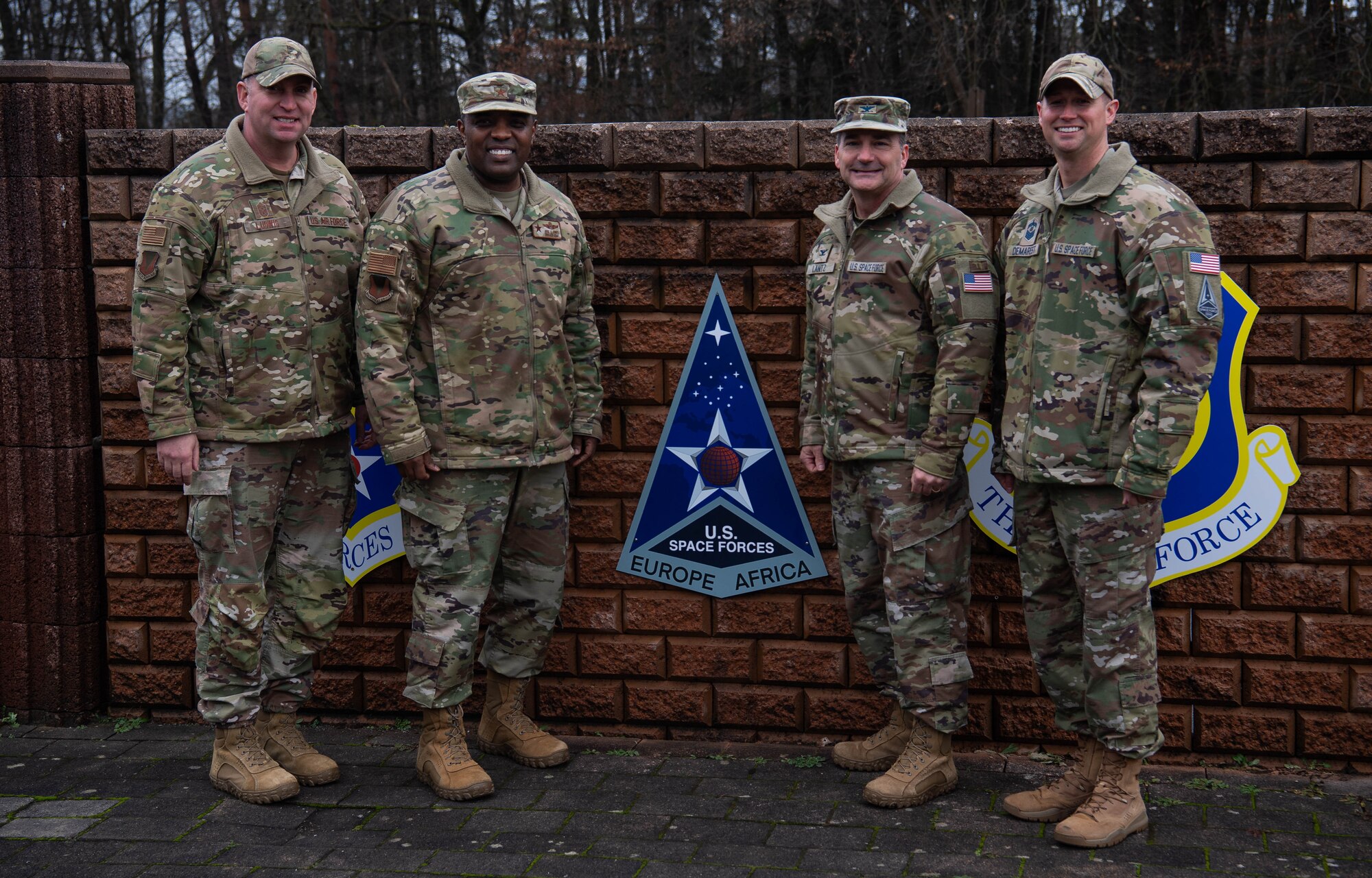 U.S. Air Force Brig. Gen. Otis C. Jones, 86th Airlift Wing commander; Chief Master Sgt. Louis Ludwig, 86th AW command chief; U.S. Space Force Col. Max E. Lantz II, U.S. Space Forces in Europe- Space Forces Africa commander; and Senior Master Sgt. Travis Demarest, USSPACEFOREUR-AF senior enlisted leader, unveil the new space component patch at Ramstein Air Base, Germany, Dec. 6, 2023. USSPACEFOREUR-AF will provide U.S. European Command and U.S. Africa
Command a cadre of space experts who collaborate with NATO allies and partners
to integrate space efforts into shared operations, activities and investments. (U.S. Air Force photo by Senior Airman Jared Lovett)