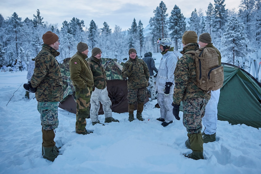 U.S. Marine Corps Maj. Gen. Robert B. Sofge Jr., commander of U.S. Marine Corps Forces Europe and Africa, speaks with Norwegian Soldiers and U.S. Marines, in Setermoen, Norway on Dec. 8, 2023. Sofge visited the Marines participating in the NATO Winter Instructor Course. The NWIC trains Marines and other service members as instructors for cold weather survival in preparation for upcoming deployments. This strategic engagement not only amplifies the significance of Sofge's direct involvement with the Marines but fosters bilateral cooperation, crucial for ongoing Marine Corps operations within Norway. (U.S. Marine Corps photo by Lance Cpl. Mary Linniman)