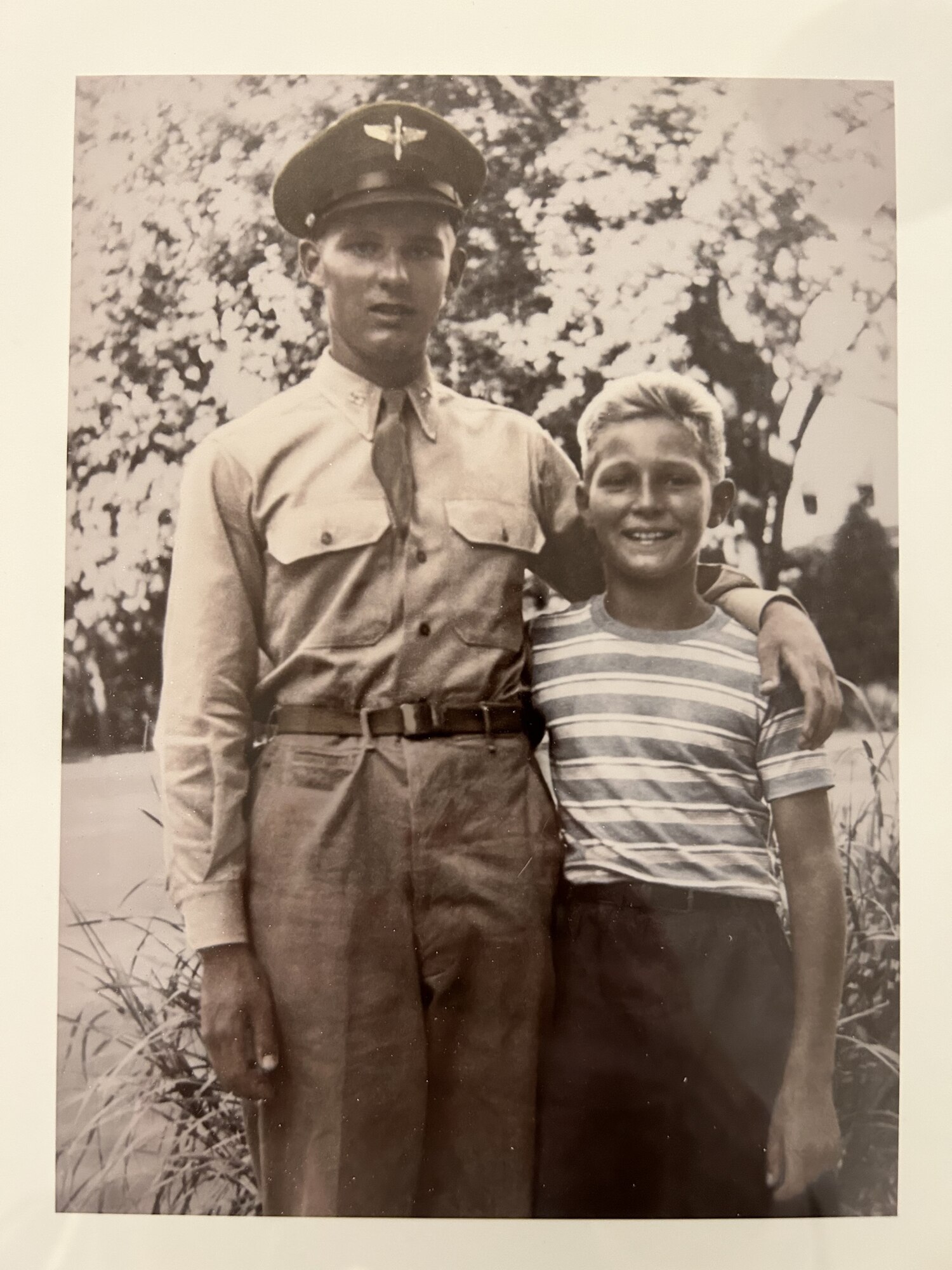 Pilot stands next to his brother.