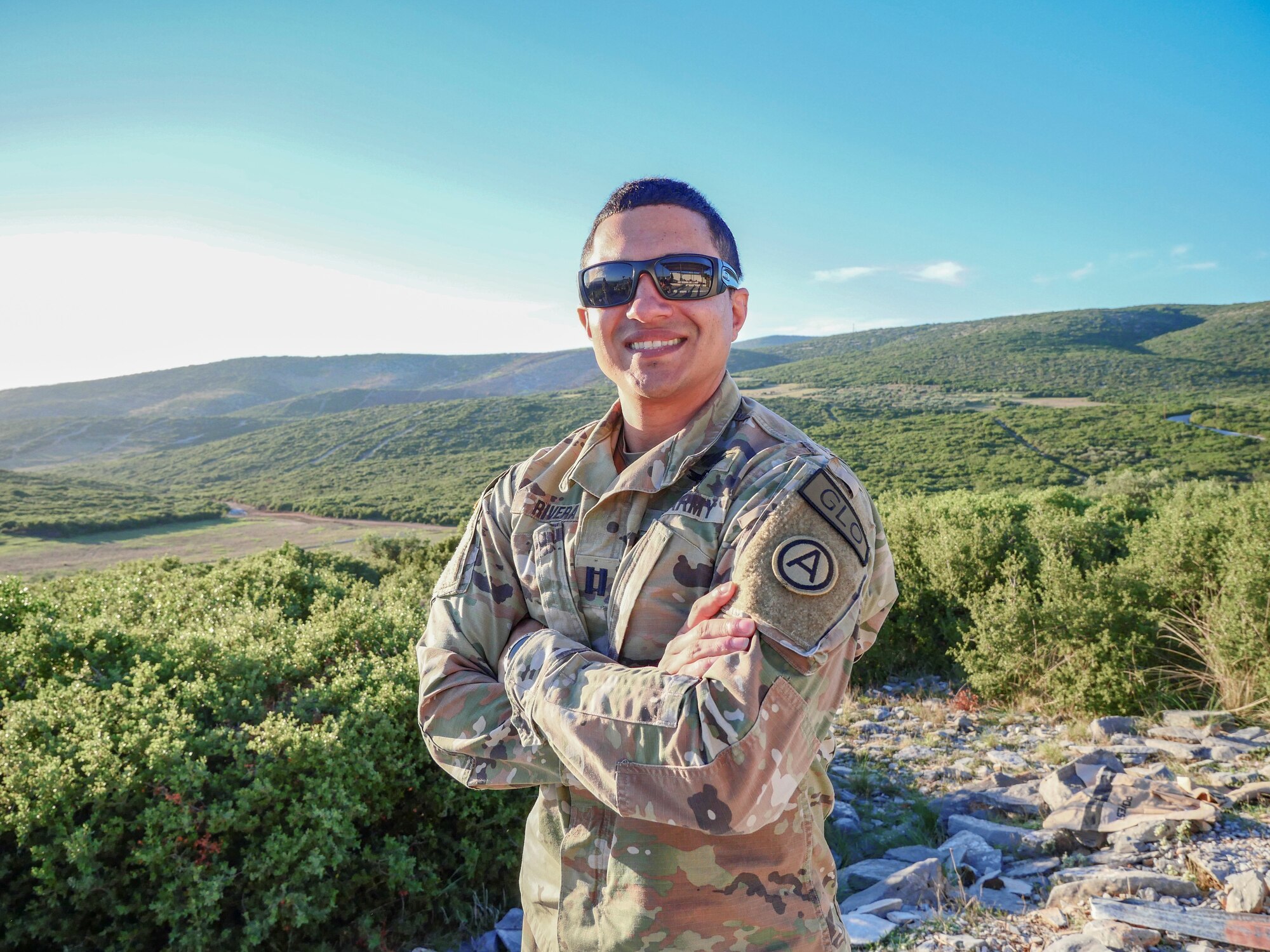 U.S. Army Capt. Luis Antonio Rivera, 9th Expeditionary Bomb Squadron ground liaison officer, poses for a photo during a joint exercise. The GLO is responsible for facilitating communication between ground units and air support. (U.S. Army photo illustration by Sgt. Nicholas Stilley)