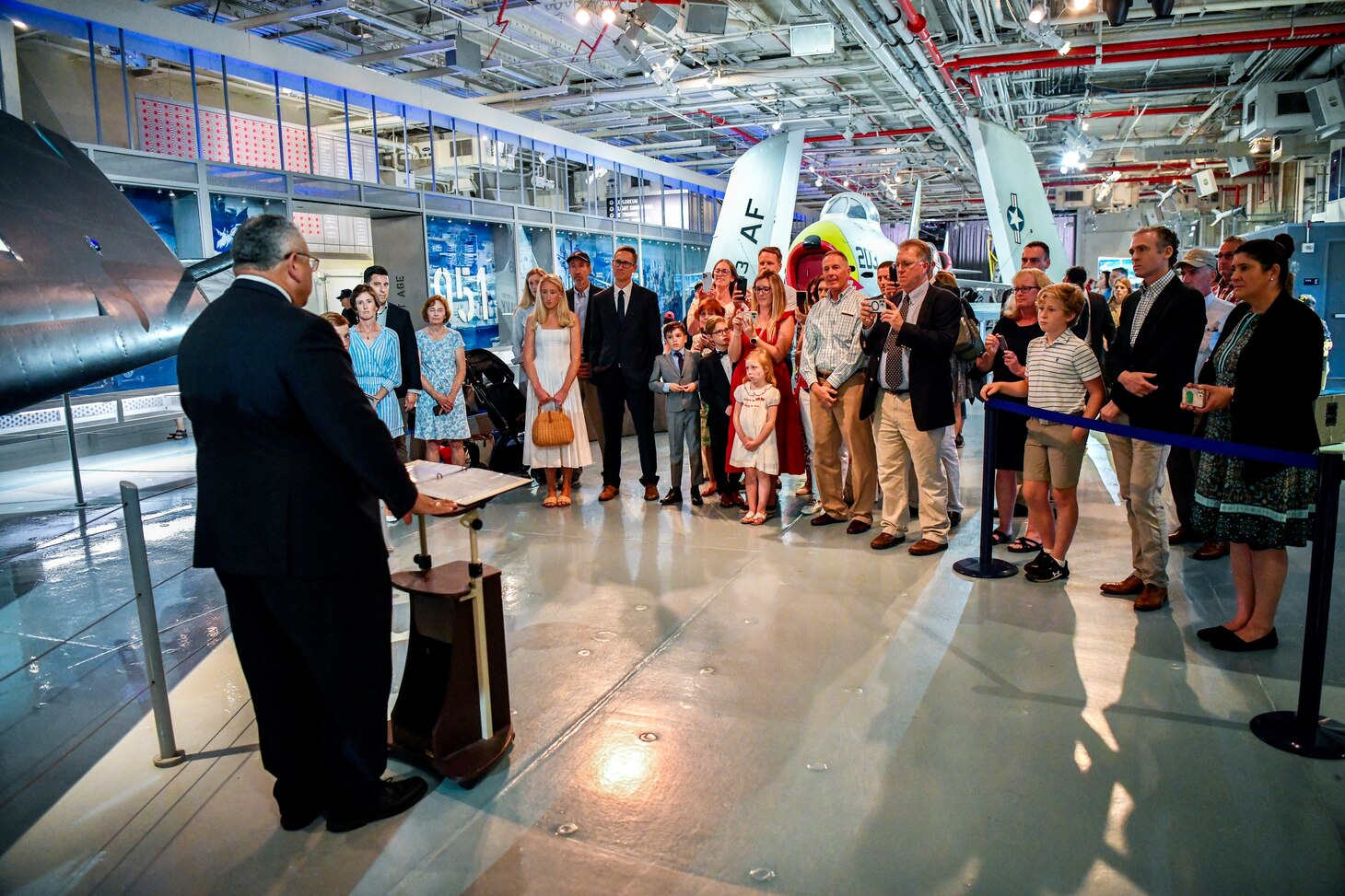 Secretary of the Navy Carlos Del Toro presents the Distinguished Flying Cross and the Air Medal posthumously to Petty Officer Peter L. Smith.