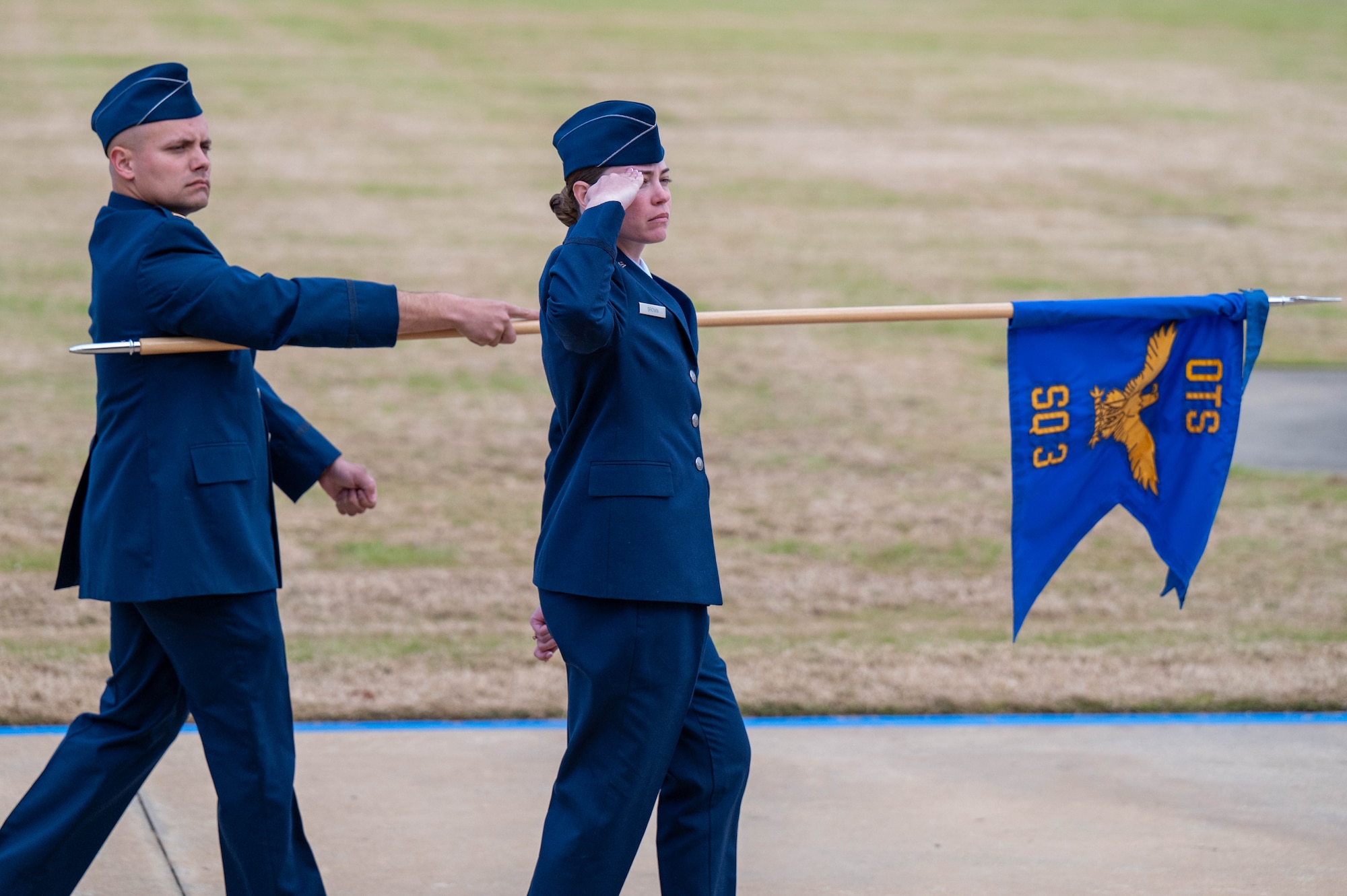 U.S. Air Force lieutenants march by for pass and review at Officer Training School, December 8, 2023, at Welch Field, Maxwell Air Force Base, Alabama. The officers comprised the first all-Space Force flight to commission from OTS. (U.S. Air Force photo by Airman Tyrique Barquet)