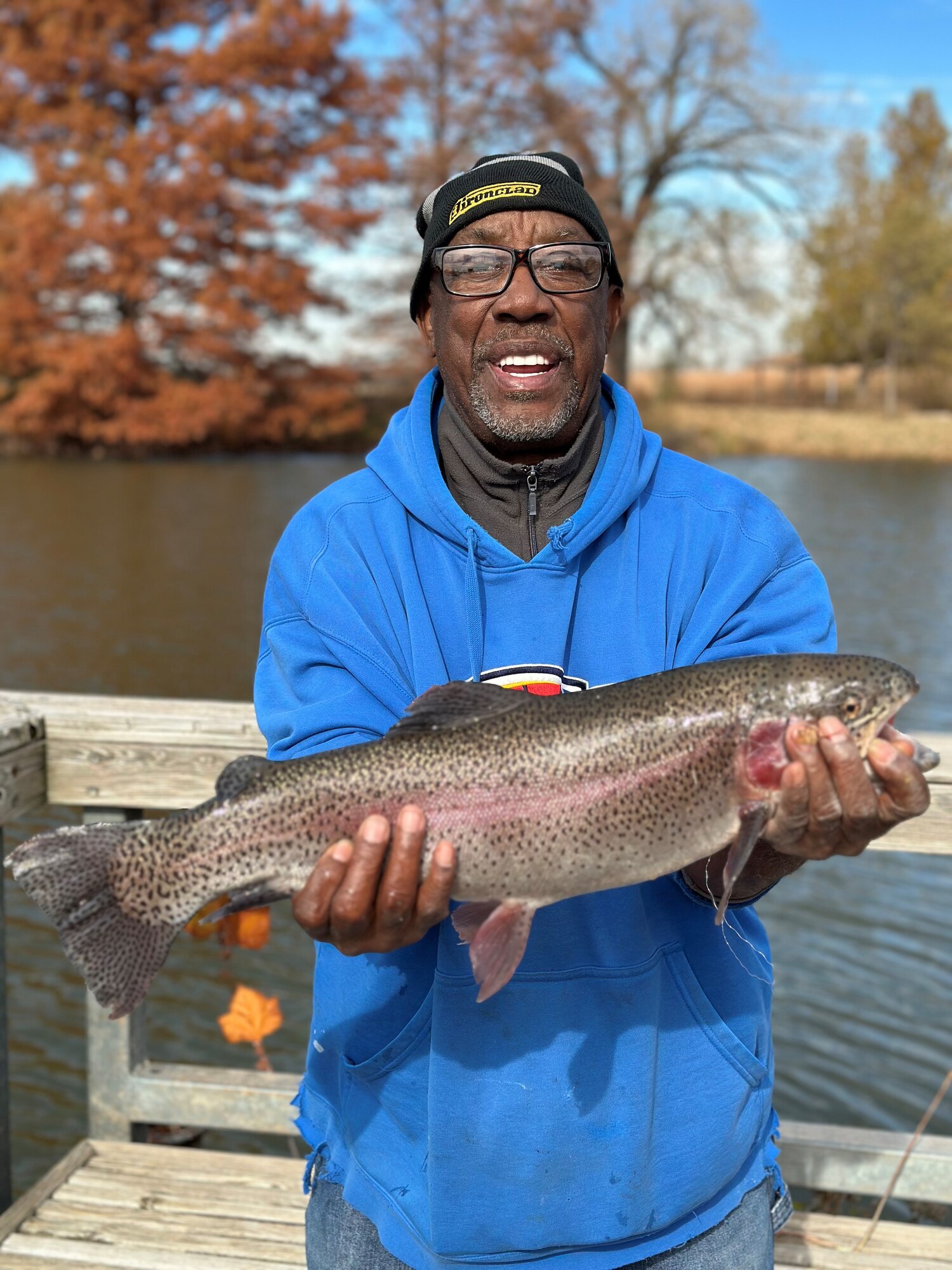 man with fish in hands