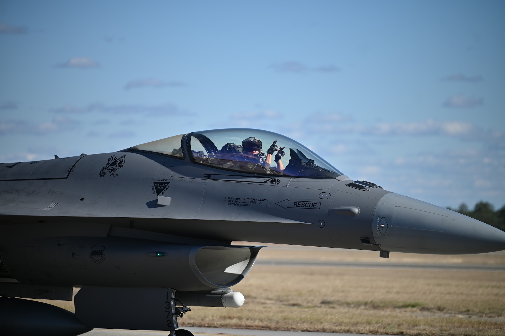 pilot in cockpit does tiger claw motion