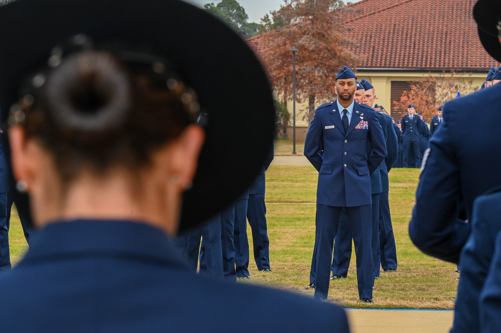 Air Force cadets at Officer Training School gather in formation on Welch Field, Maxwell Air Force Base, Alabama, December 8, 2023. The first OTS-V class graduating OTS at Welch Field in military formation. (U.S. Air Force photo by Airman Tyrique Barquet)