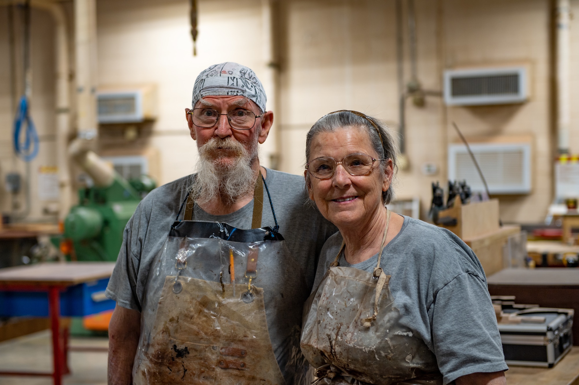 John Fischbach Sr., 23rd Force Support Squadron recreation aid, and Gail Fischbach, 23rd FSS recreation woodshop volunteer, smile together at Moody Air Force Base, Georgia Nov. 28, 2023. The couple have worked together in the woodshop for over 11 years. (U.S. Air Force photo by Senior Airman Courtney Sebastianelli)