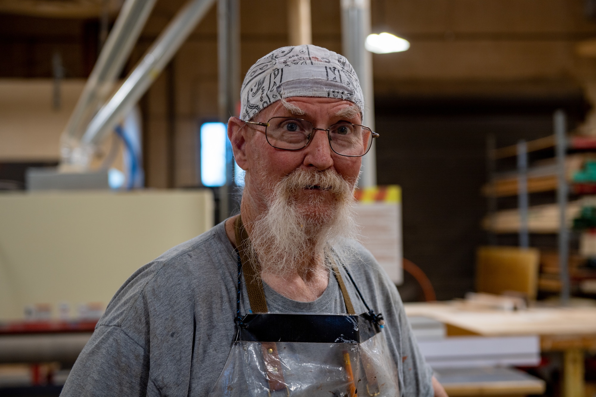 John Fischbach Sr., 23rd Force Support Squadron recreation aid, poses for a photo in the woodshop at Moody Air Force Base, Georgia, Nov. 28, 2023. Fischbach has spent over 45 years mastering woodwork. (U.S. Air Force photo by Senior Airman Courtney Sebastianelli)