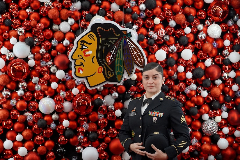 U.S. Army Reserve Sgt. Maribel Meraz, 85th U.S. Army Reserve Support Command, pauses for a photo during a Chicago Blackhawks Military Salute game. Meraz was recognized, there, for her service before the playing of the National Anthem at the Blackhawks home game versus St. Louis Blues, December 9, 2023.