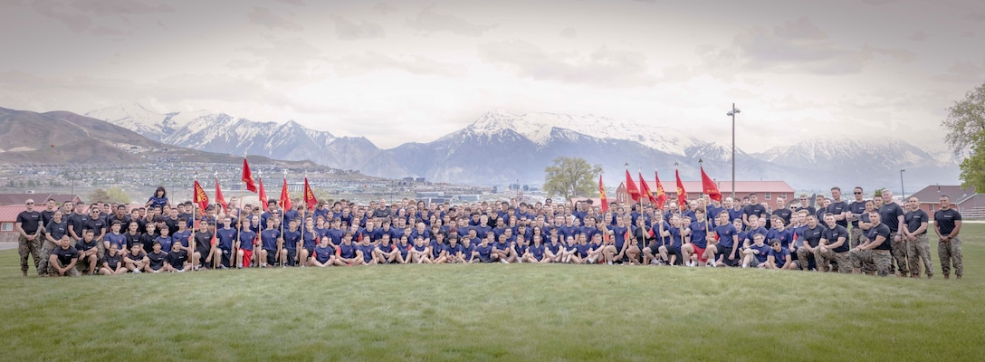 U.S. Marines and Poolees with Recruiting Station Salt Lake City all pose for a group photo after the Annual Pool Function at Camp Williams, Utah, on May 15-16, 2023.