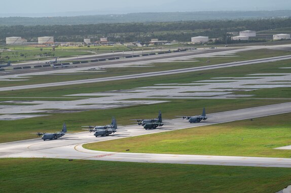 Three U.S. Air Force (USAF) C-130J Super Hercules aircraft assigned to the 36th Expeditionary Airlift Squadron participate in an elephant walk alongside a Royal Canadian Air Force (RCAF) C-130J Super Hercules assigned to the 436th Transport Squadron, a Japan Air Self-Defense Force (JASDF) C-130H Hercules assigned to the 401st Tactical Airlift Squadron, and a Republic of Korea Air Force (ROKAF) C-130H Hercules assigned to the 251st Airlift Squadron, at Andersen Air Force Base, Guam, Dec. 9, 2023, during Operation Christmas Drop 2023 (OCD 23). USAF, RCAF, JASDF, and ROKAF crewmembers delivered 210 bundles to 58 islands over the span of six days. The deliveries of humanitarian aid reached over 42 thousand remote Micronesian islanders across 1.8 million square miles. (U.S. Air Force photo by Tech. Sgt. Taylor Altier)