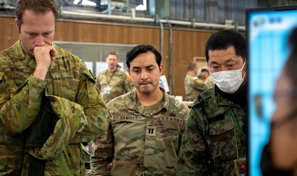 Japanese, U.S., and Australian participants take part in a joint rehearsal during Yama Sakura 85 at Camp Higashi-Chitose, Japan, Dec. 11, 2023. As a part of U.S. Army Pacific's Operation Pathways, the 43rd iteration of Yama Sakura exercise, YS-85, is the first U.S. Army, Japan Ground Self-Defense Force, and Australian Army command post exercise based in Japan. This trilateral exercise was an opportunity to hone interoperability between nations and work together toward a common goal. (U.S. Army photo by Spc. Austin Robertson)
