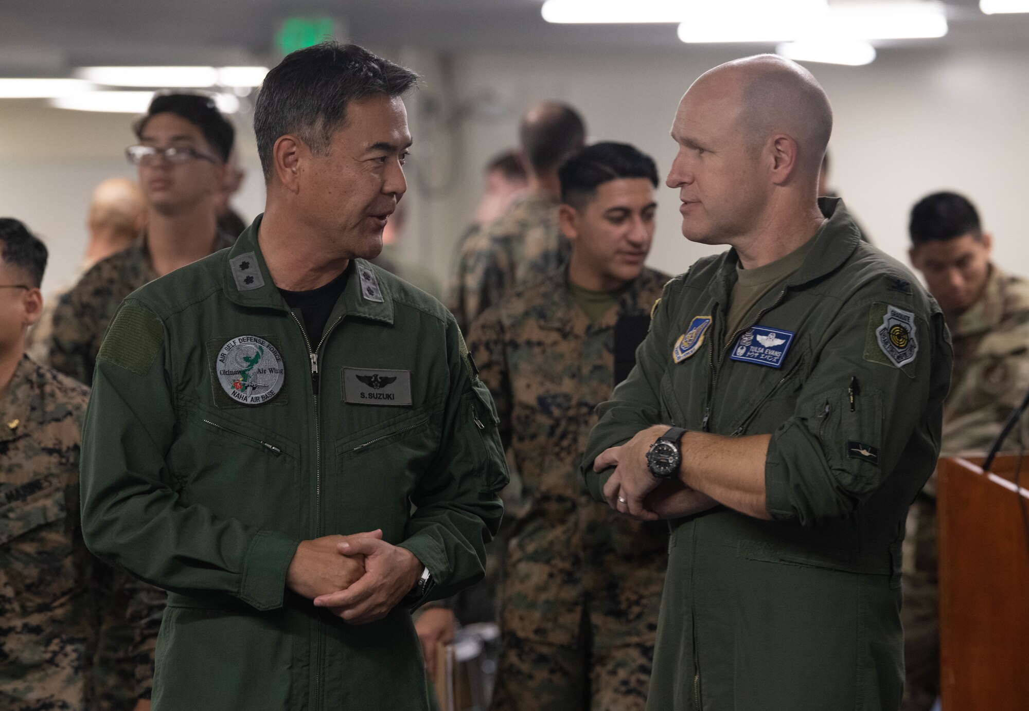 Japan Air Self-Defense Force Maj. Gen. Shigenao Suzuki converses with U.S. Air Force Col. Nicholas Evans before the start of the Okinawa Bilateral Tactics Exchange.
