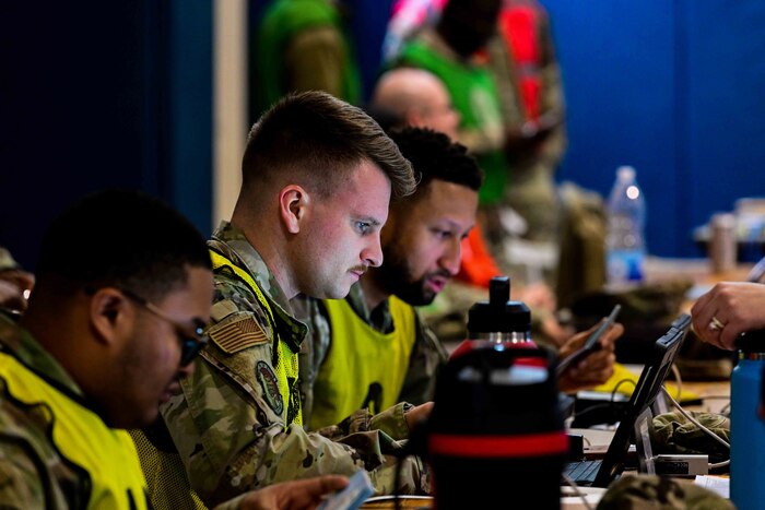 U.S. Air Force Airmen assigned to the 31st Fighter Wing practice out-processing military dependents during Exercise Fighting Wyvern.