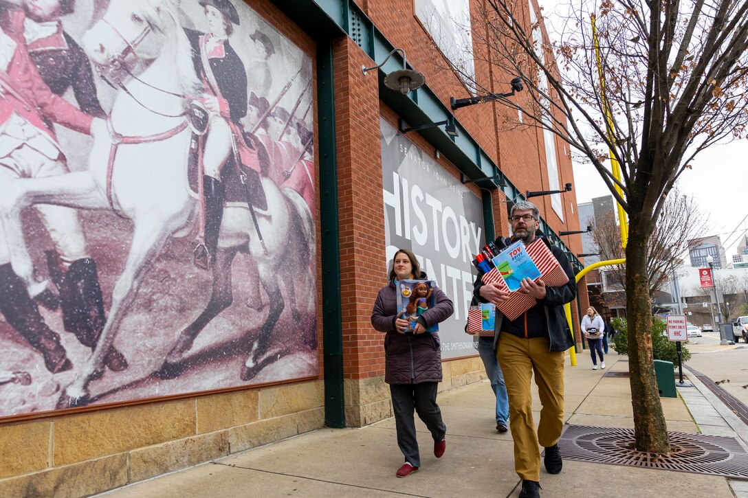 U.S. Army Corps of Engineers Pittsburgh District employees deliver bags and boxes of toys to the Senator John Heinz History Center as part of their annual toy drive, Dec. 7, 2023.