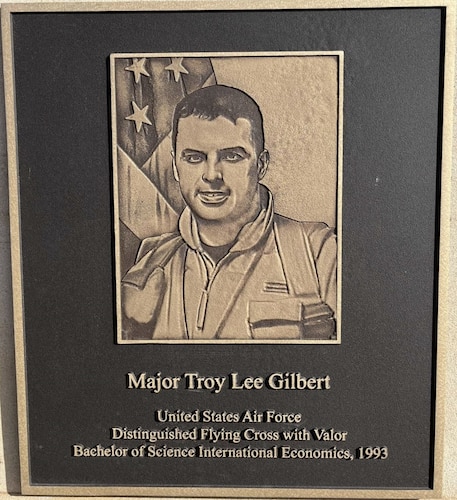 Texas Tech University unveiled a commemorative plaque honoring 1993 graduate Maj. Troy ‘Trojan’ Gilbert during its centennial celebration, Nov. 17, 2023. Gilbert was an F-16 pilot and lost his life in 2006 during a strafing run against enemy positions during Operation Iraqi Freedom. Air Force ROTC Detachment 820 at the university also dedicated a heritage room in honor of Gilbert. He commissioned from Air Force Officer Training School, Maxwell Air Force Base, Alabama, in 1995. The school renamed its headquarters building Gilbert Hall during a dedication ceremony in 2009. (U.S. Air Force photo by Kendall Jones)