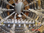 Scientists and engineers at Naval Surface Warfare Center, Carderock Division evaluate a small-scale model of the Arleigh Burke-class destroyer's magnetic signature in its Large Scale Magnetic Field Range Bar Sensors in West Bethesda, Maryland, on Nov. 19, 2004. Carderock scientists can conduct precise magnetic measurements in this facility replicating any magnetic field around the world.