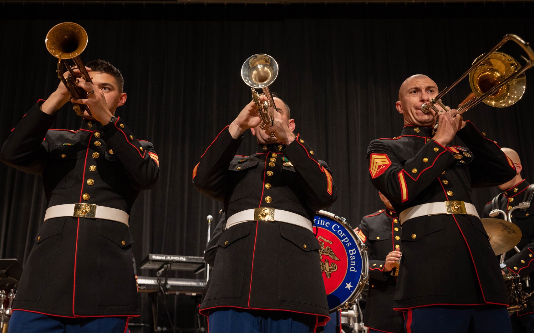 U.S. Marine Corp Cpl. Dominic Muller, trumpet, left, Sgt. James Dawson, trumpet, center, and Sgt. Seth Parrish, trombone, right, all with the Quantico Marine Band, perform during the annual Holiday Concert at Little Hall on Marine Corps Base Quantico, Virginia, Dec. 10, 2023. The band’s mission is to provide musical support that will encourage community relations, enhance troop morale, and promote the Marine Corps recruiting program through its demanding performance schedule. (U.S. Marine Corps photo by Cpl. Mitchell Johnson)