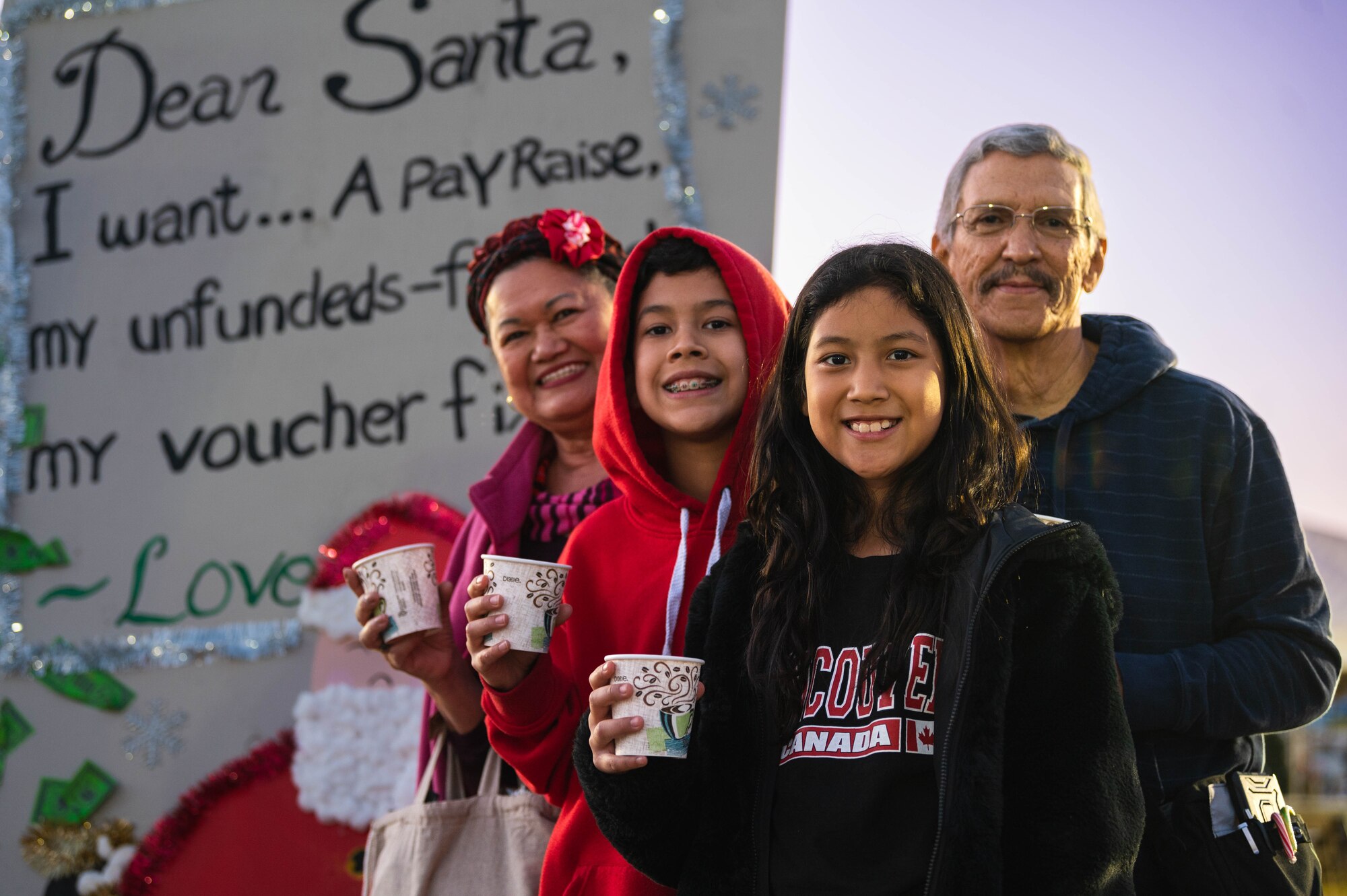 U.S. Air Force Brig. Gen. Jason Rueschhoff (right), 56th Fighter Wing commander, and Chief Master Sgt. Jason Shaffer (left), 56th Fighter Wing command chief, address Luke Air Force Base personnel and their families during a Holiday Magic event.