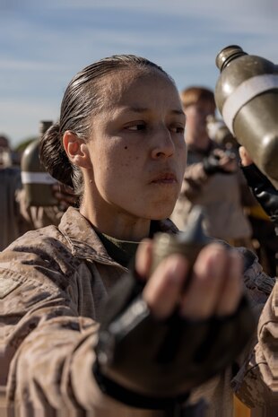 U.S. Marine Corps Recruit Amanda K. Contreras, with Echo Company, 2nd Recruit Training Battalion, hydrates during a Marine Corps Martial Arts Program training event at Marine Corps Recruit Depot San Diego, Nov. 27, 2023. MCMAP aims to strengthen the mental and moral resiliency of recruits and Marines through realistic combative training, warrior ethos studies, and physical hardening. Contreras is a native of Oceanside, California. (U.S. Marine Corps photo by Lance Cpl. Janell B. Alvarez)