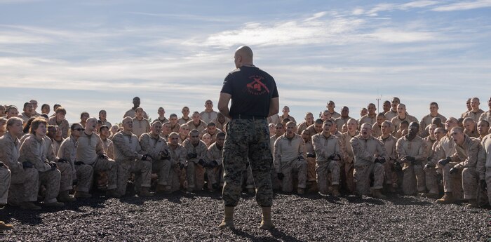 U.S. Marine Corps Staff Sgt. Javier Acosta, a martial arts instructor with Support Battalion, speaks to Echo Company, 2nd Recruit Training Battalion, during a Marine Corps Martial Arts Program training event at Marine Corps Recruit Depot San Diego, Nov. 27, 2023. MCMAP aims to strengthen the mental and moral resiliency of recruits and Marines through realistic combative training, warrior ethos studies, and physical hardening. Acosta is a native of Phoenix, Arizona. (U.S. Marine Corps photo by Lance Cpl. Janell B. Alvarez)
