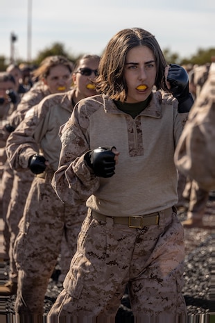 U.S. Marine Corps Recruit Madison Hamby, with Echo Company, 2nd Recruit Training Battalion, executes a knife hand strike during a Marine Corps Martial Arts Program training event at Marine Corps Recruit Depot San Diego, Nov. 27, 2023. MCMAP aims to strengthen the mental and moral resiliency of recruits and Marines through realistic combative training, warrior ethos studies, and physical hardening. Hamby is a native of Phoenix, Arizona. (U.S. Marine Corps photo by Lance Cpl. Janell B. Alvarez)