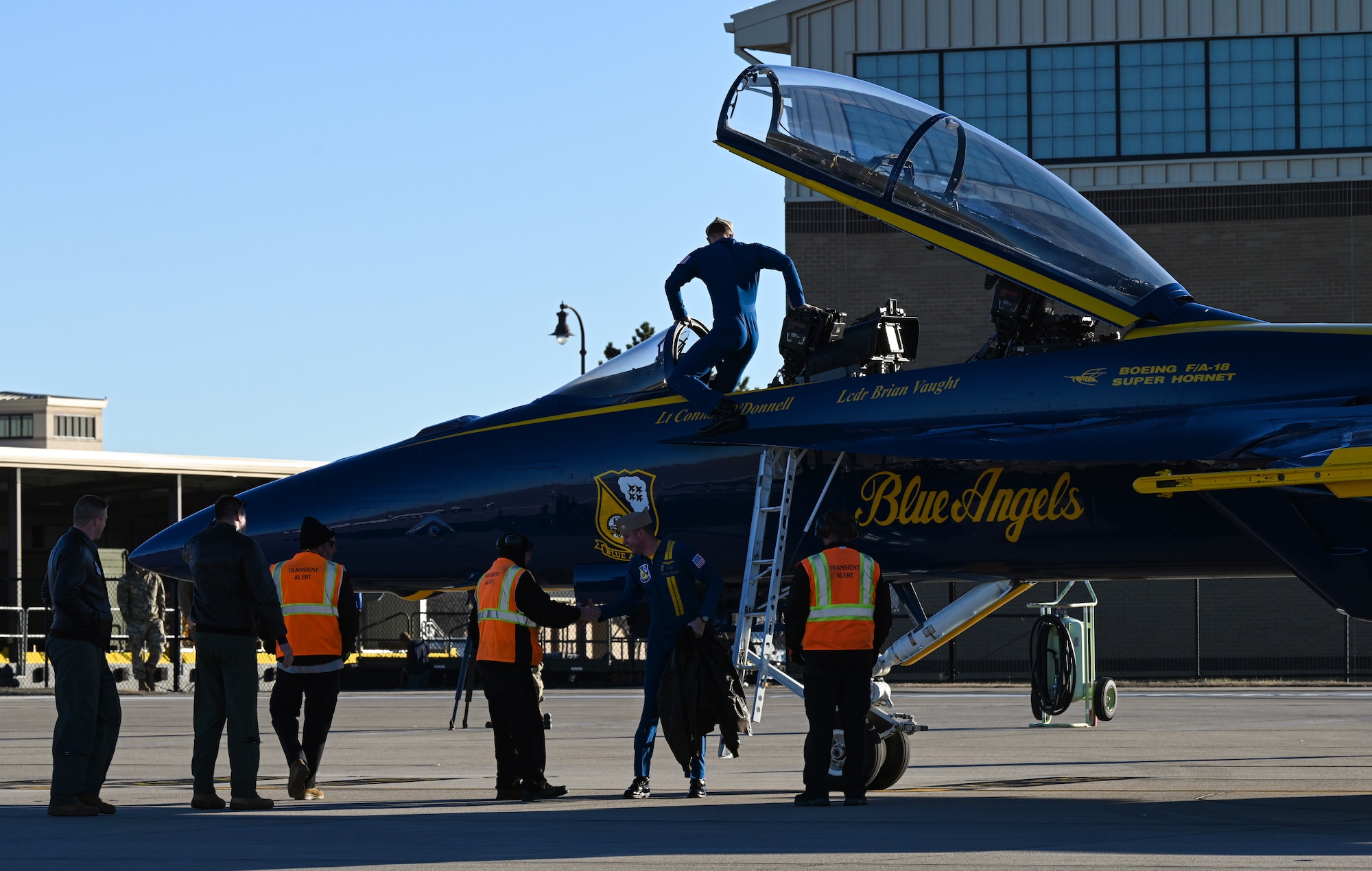 U.S. Navy Flight Demonstration Squadron, the Blue Angels, narrator Navy Lt. Connor O’Donnell, exits an F/A-18 Super Hornet Dec. 11, 2023, at McConnell Air Force Base, Kansas. Two Blue Angels visited McConnell in preparation for their part in the Frontiers in Flight Air Show on Aug. 24-25, 2024. (U.S. Air Force photo by Staff Sgt. Tryphena Mayhugh)
