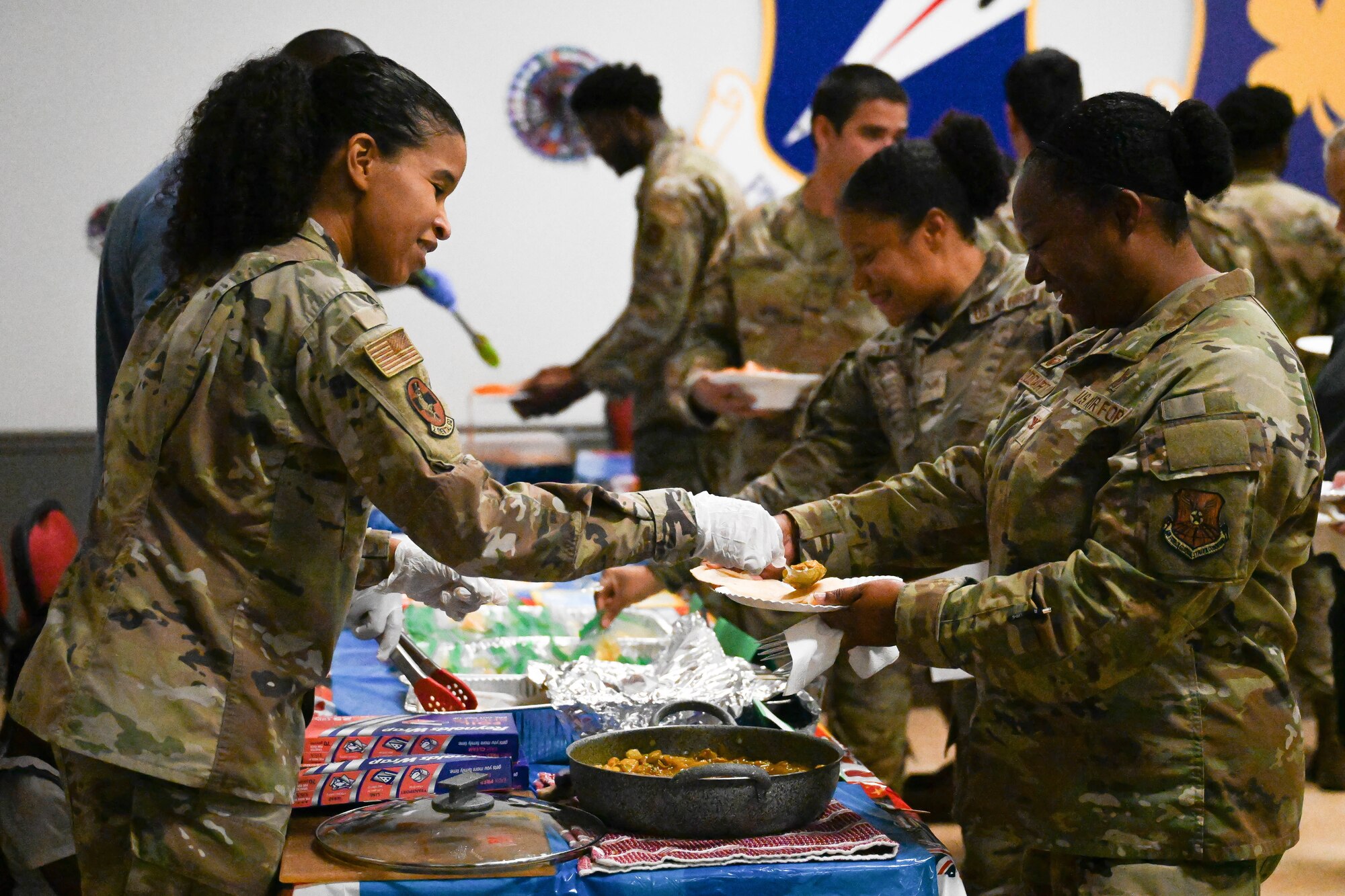 1st Lt. Keenan Duncan served Irish Stew during Barksdale Air Force Base’s “Around-the-World” potluck. (U.S. Air Force photo by Senior Airman Danielle James)