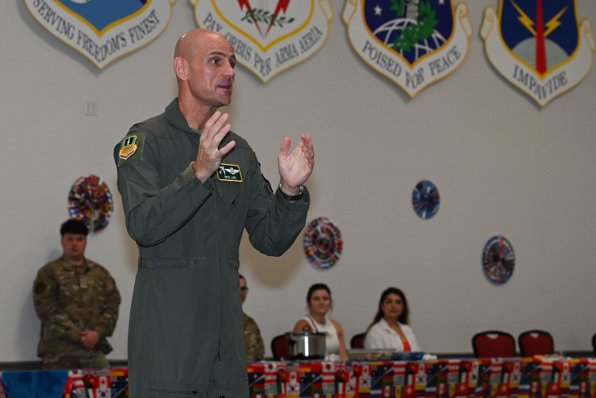Col. Erick D. Lord, Deputy Commander, 2nd Bomb Wing, Barksdale Air Force Base, delivered the opening speech for the inaugural “Around the World” potluck. (U.S. Air Force photo by Senior Airman Danielle James)