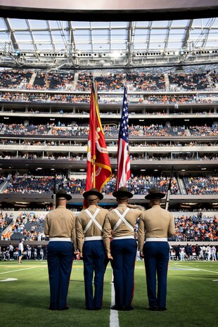 U.S. Marines with the Depot Color Guard of Marine Corps Recruit Depot San Diego, present the National and Marine Corps colors during a ceremony at SoFi Stadium, Inglewood, California, Dec. 10, 2023. The Marine Corps color guard performances are a longstanding tradition that entrusts Marines with displaying the National Ensign alongside the official Battle Color of the Marine Corps to render appropriate military honors. (U.S. Marine Corps photo by Sgt. Yvonna Guyette)
