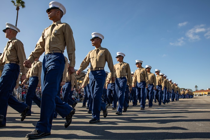 U.S. Marines with Charlie Company, 1st  Recruit Training Battalion, march in formation during their graduation ceremony at Marine Corps Recruit Depot San Diego, Dec. 8, 2023. Graduation took place at the completion of the 13-week transformation, which included training for drill, marksmanship, basic combat skills, and Marine Corps customs and traditions. (U.S. Marine Corps photo by Lance Cpl. Sarah M. Grawcock)