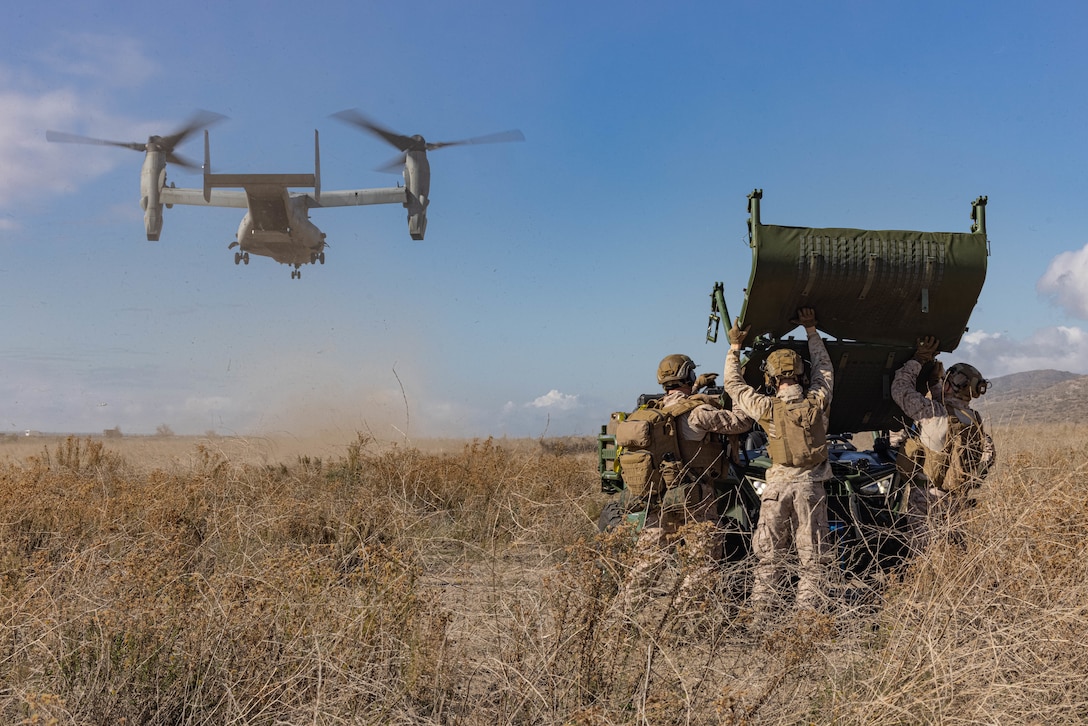 U.S. Marines with 5th Marine Regiment, 1st Marine Division, unfold the roof of an Ultra Light Tactical Vehicle after unloading it from an MV-22B Osprey assigned to Marine Medium Tiltrotor Squadron 164, Marine Aircraft Group 39, 3rd Marine Aircraft Wing, during a mission rehearsal exercise as part of Steel Knight 23.2 at Marine Corps Base Camp Pendleton, California, Nov. 30, 2023. Steel Knight maintains and sharpens I Marine Expeditionary Force as America’s expeditionary force in readiness – organized, trained and equipped to respond to any crisis, anytime, anywhere. This exercise will certify 5th Marines to be forward-postured in Australia as Marine Rotational Force - Darwin, a six-month deployment during which Marines train with Australian allies and facilitate rapid response to crises and contingencies. (U.S. Marine Corps photo by Lance Cpl. Juan Torres)