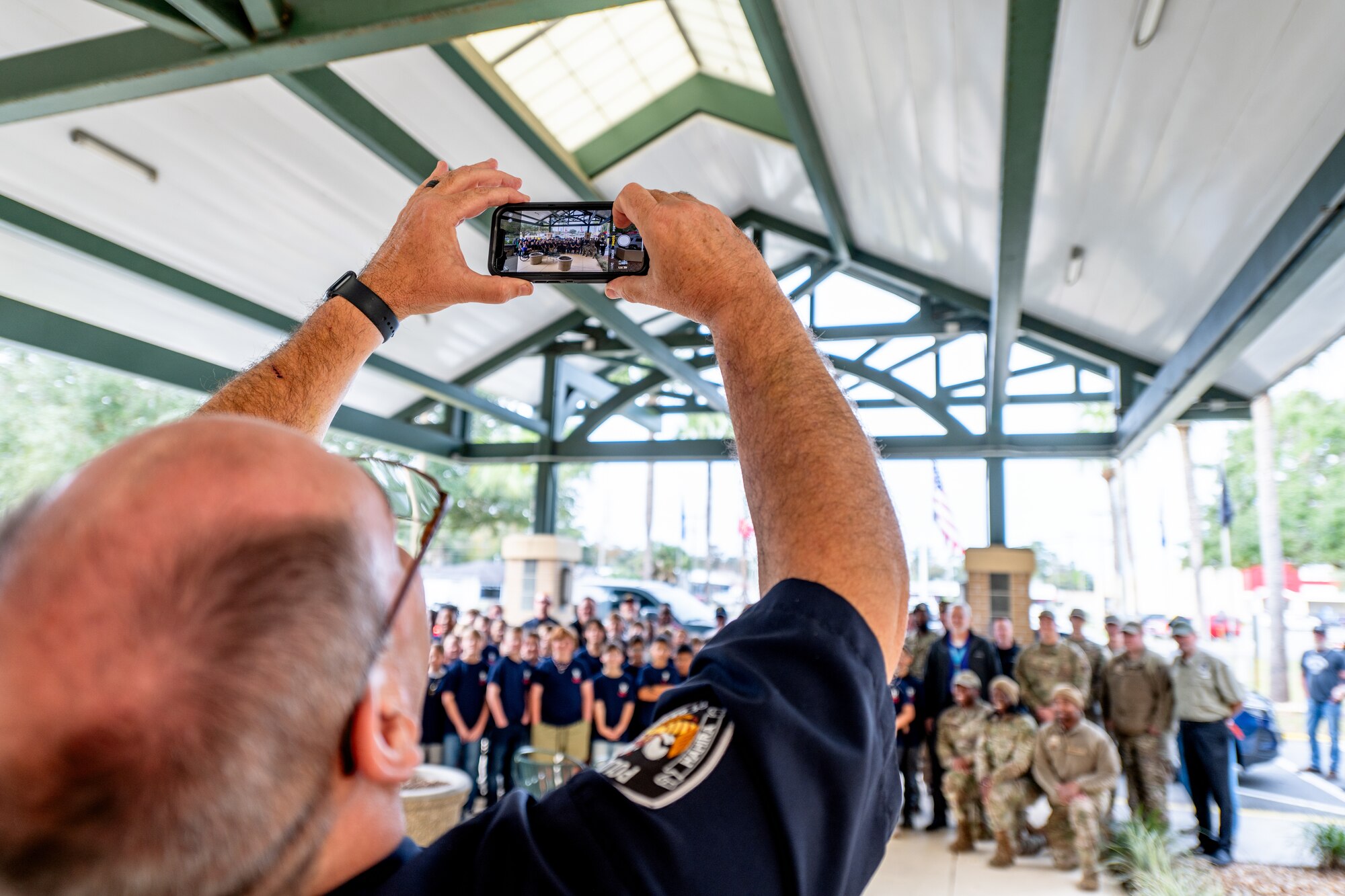 Person taking a photo of a group of people