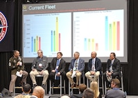 Panel of Soldiers and industry professionals on stage.