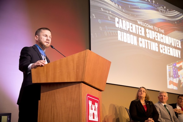 Cpl. Kyle Carpenter, the youngest and one of only eight living recipients to be awarded the Medal of Honor for actions in Afghanistan speaks at the dedication ceremony for a new supercomputer named in his honor at the U.S. Army Engineer Research and Development Center in Vicksburg, Mississippi, December 12, 2023. (U.S. Army Corps of Engineers photo by Jared Eastman)