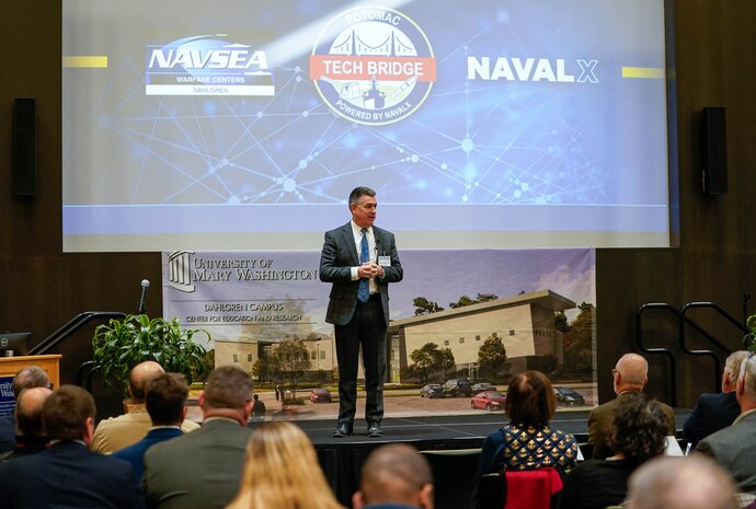 IMAGE: Naval Surface Warfare Center Dahlgren Division Technical Director Dale Sisson Jr., P.E., SES, addresses attendees during the Potomac Tech Bridge kickoff event Dec. 12 at University of Mary Washington Dahlgren Campus.