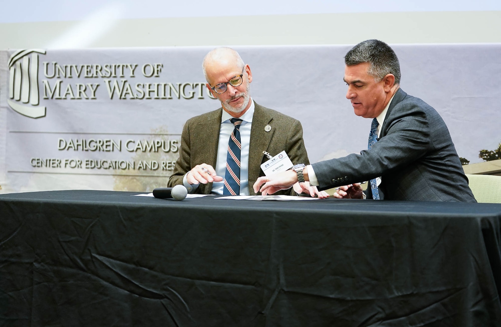 IMAGE: University of Mary Washington (UMW) President Dr. Troy Paino (left) and Naval Surface Warfare Center Dahlgren Division Technical Director Dale Sisson Jr., P.E., SES, signed a Partnership Intermediary Agreement between the university and the installation at the Potomac Tech Bridge kickoff event Dec. 12 at UMW Dahlgren Campus.